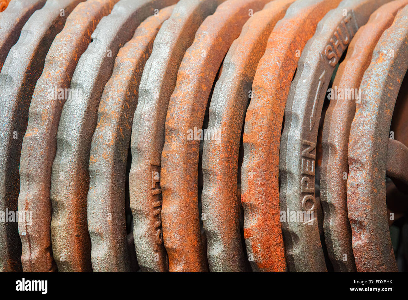 Steel rusted hand wheels in warehouse Stock Photo