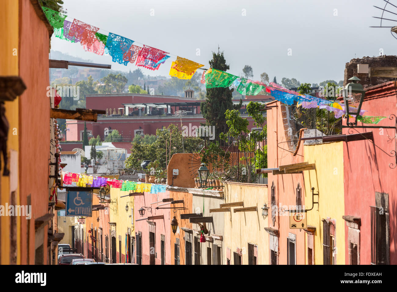 Papel picado banners decorate a street in the historic center of San Miguel de Allende, Mexico. Stock Photo