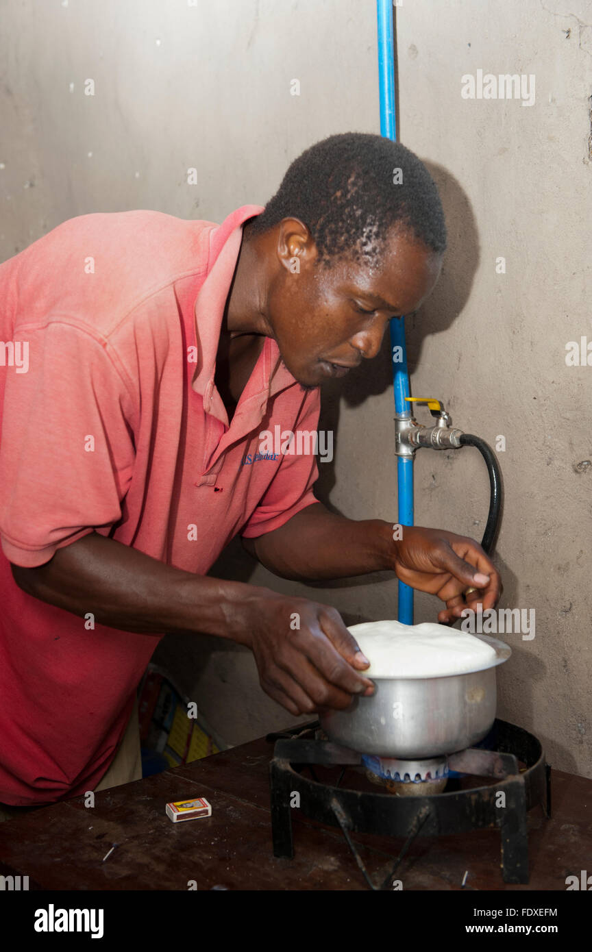 Cooking over a stove powered with methane gas from stored cattle manure