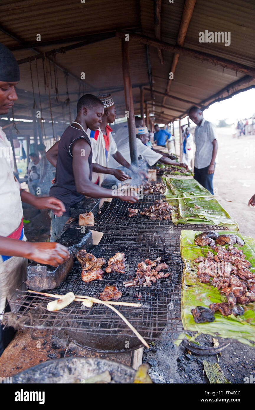 Cooking food on a roadside BBQ in Uganda Stock Photo Alamy