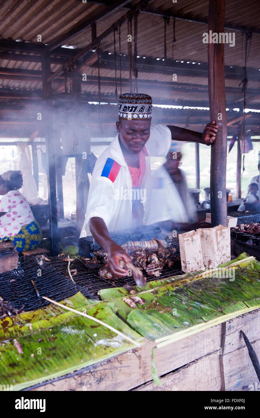 Cooking food on a roadside BBQ in Uganda Stock Photo Alamy