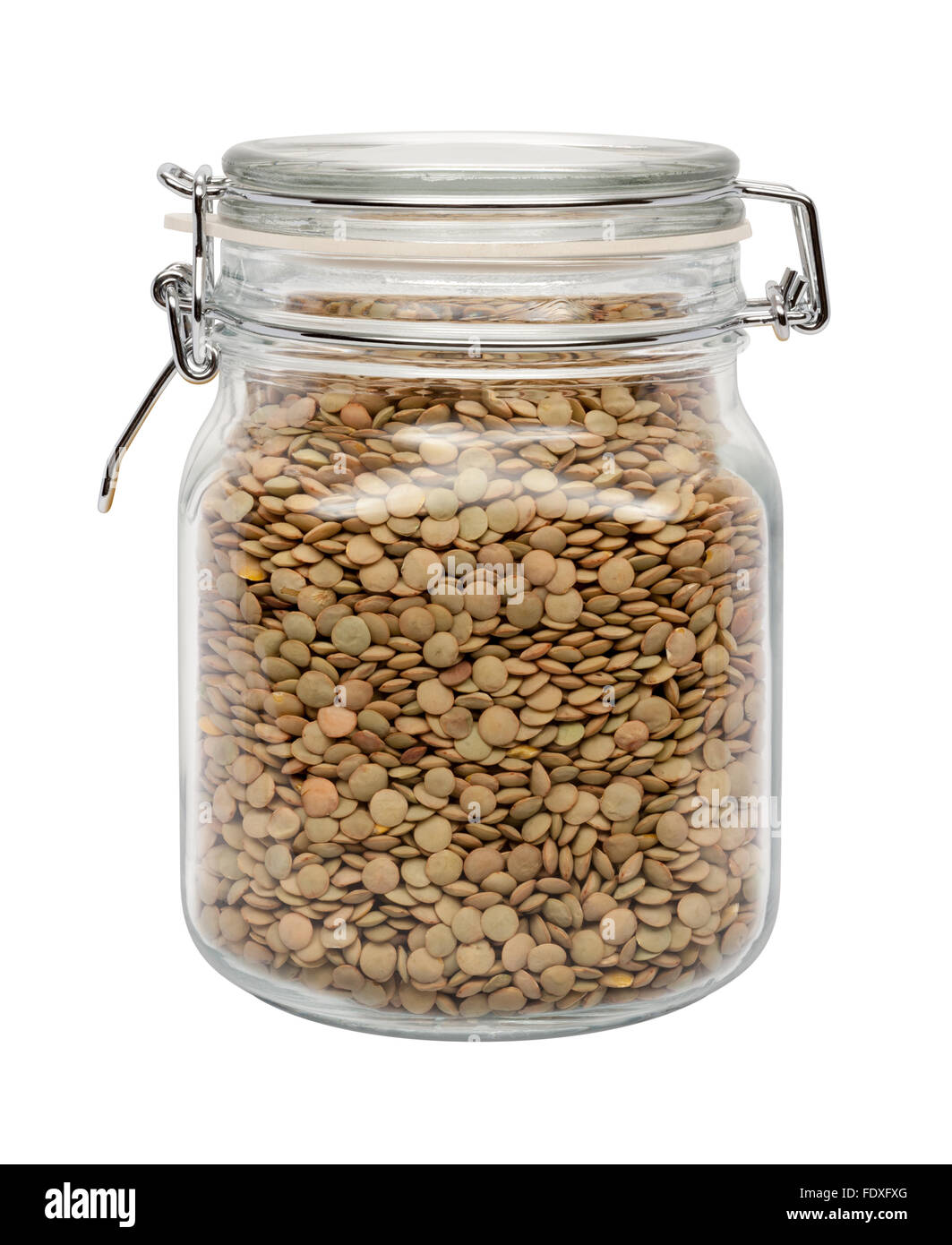 Lentils in a Glass Canister with a Metal Clamp. The image is a cut out, isolated on a white background. Stock Photo