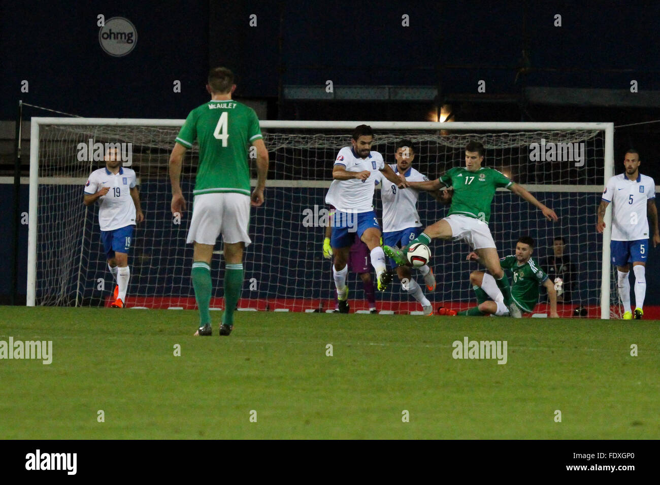 08 Oct 2015 - Euro 2016 Qualifier - Group F - Northern Ireland 3 Greece 1. Paddy McNair (17) under pressure from Greek defenders Alexandros Tziolis (left) and Panagiotis Kone (8). Stock Photo