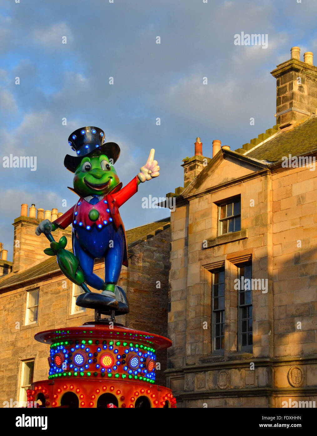 Jiminy Cricket atop one of the  funfair  rides in St Andrews, fife, during Lammas fair and market, annual visit. Stock Photo
