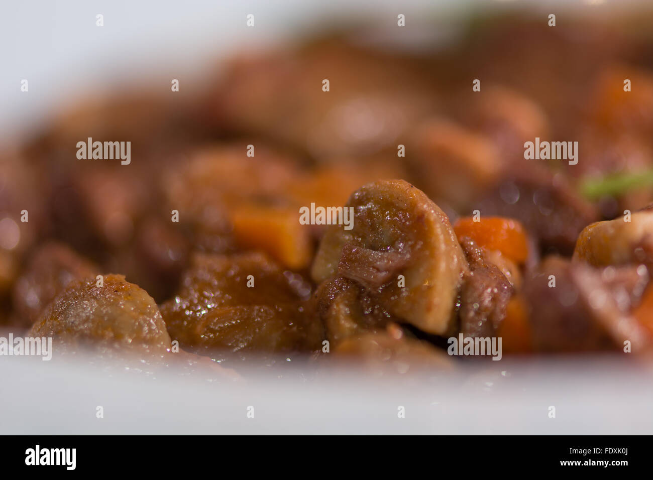 Classic French dish including mushrooms, beef and vegetable, presented on a white plate, from above Stock Photo