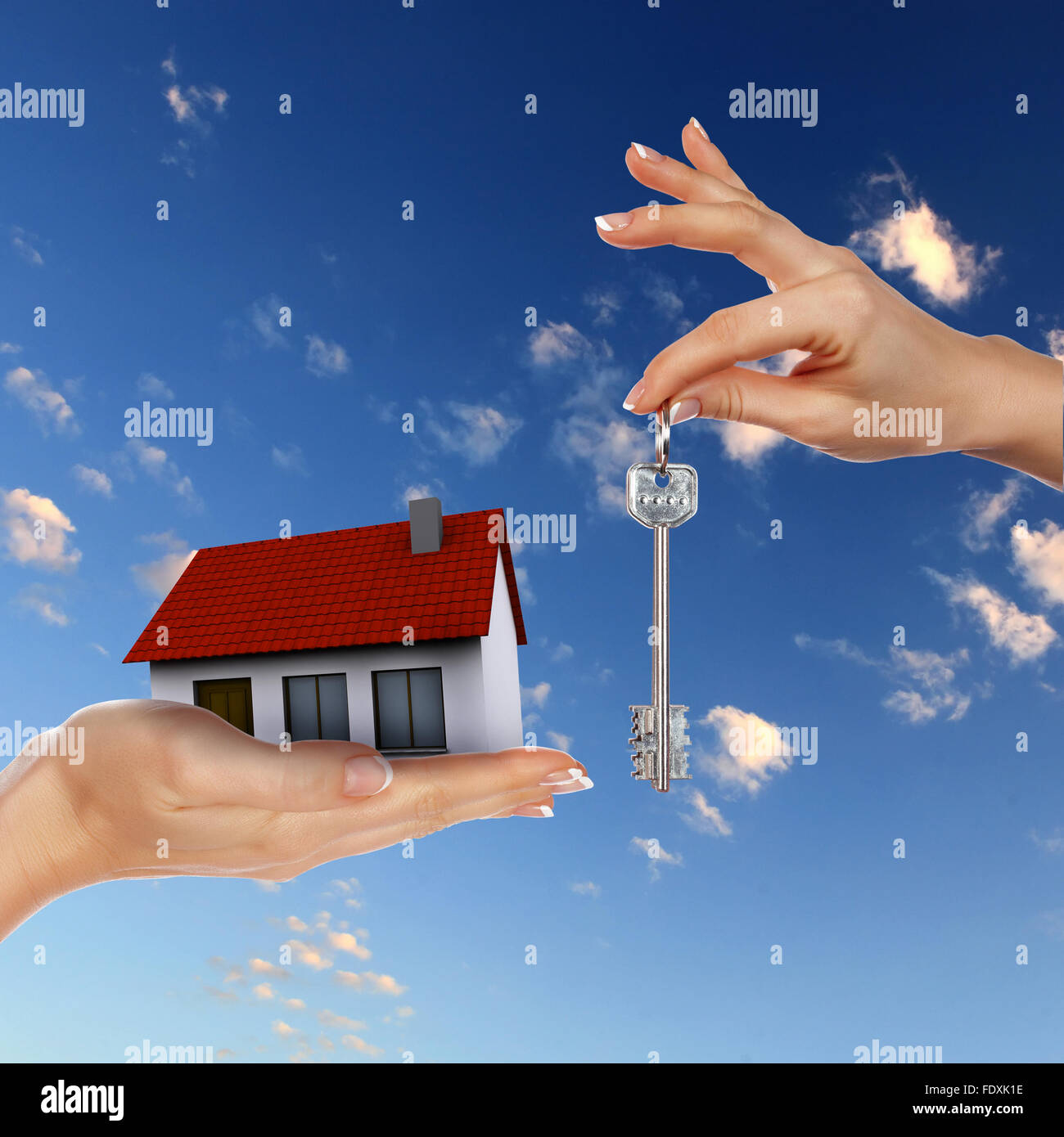 Human hand against blue sky background and house Stock Photo - Alamy
