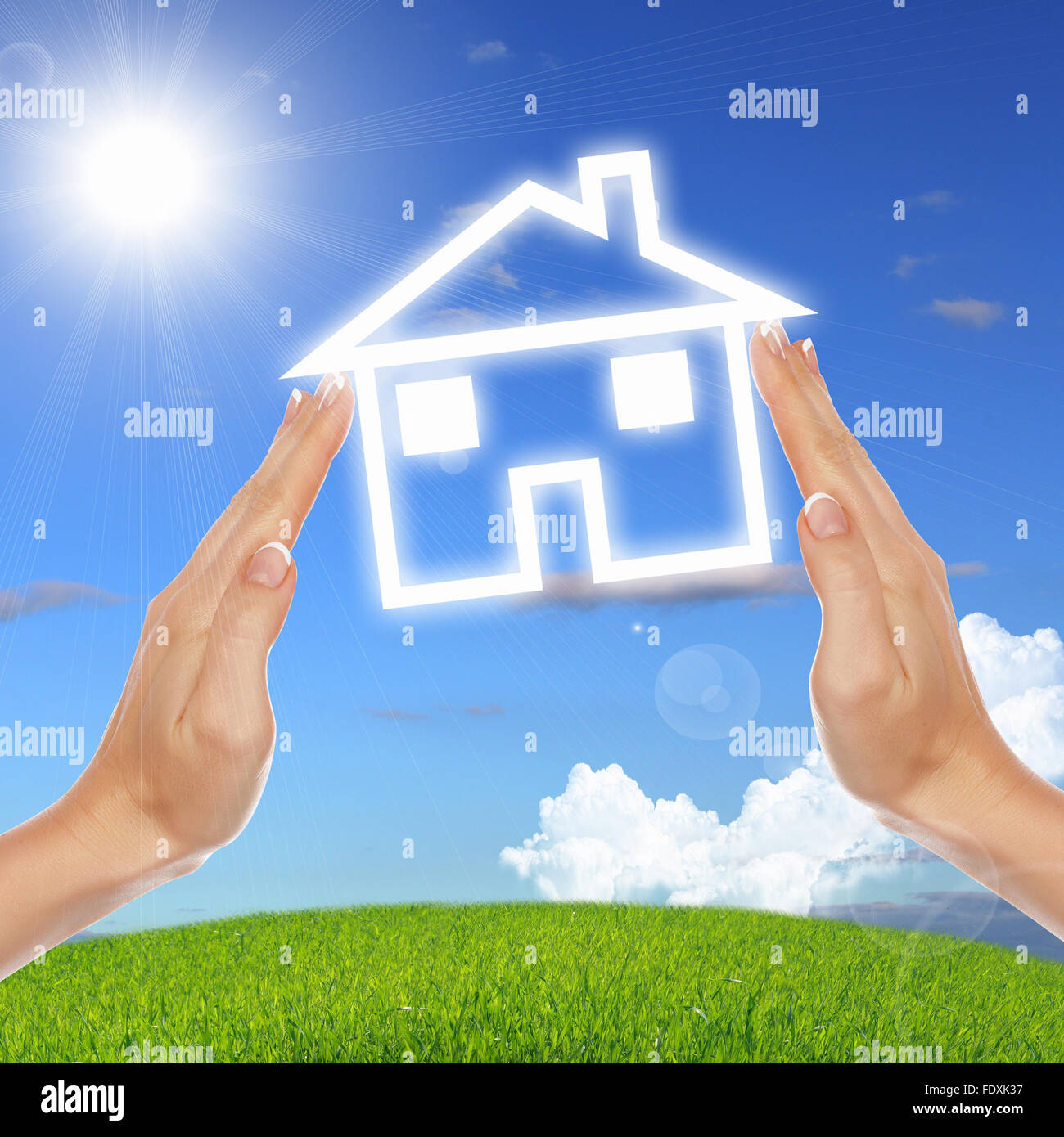 Human hand against blue sky background and house Stock Photo - Alamy