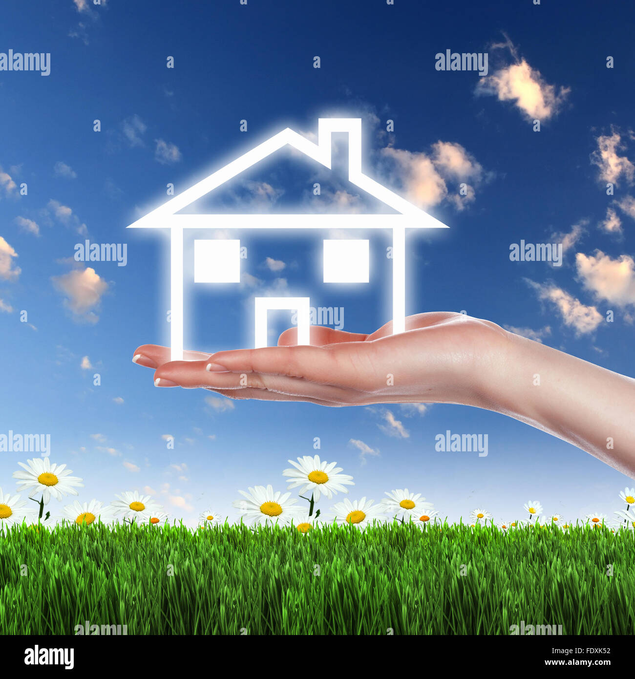 Human hand against blue sky background and house Stock Photo - Alamy