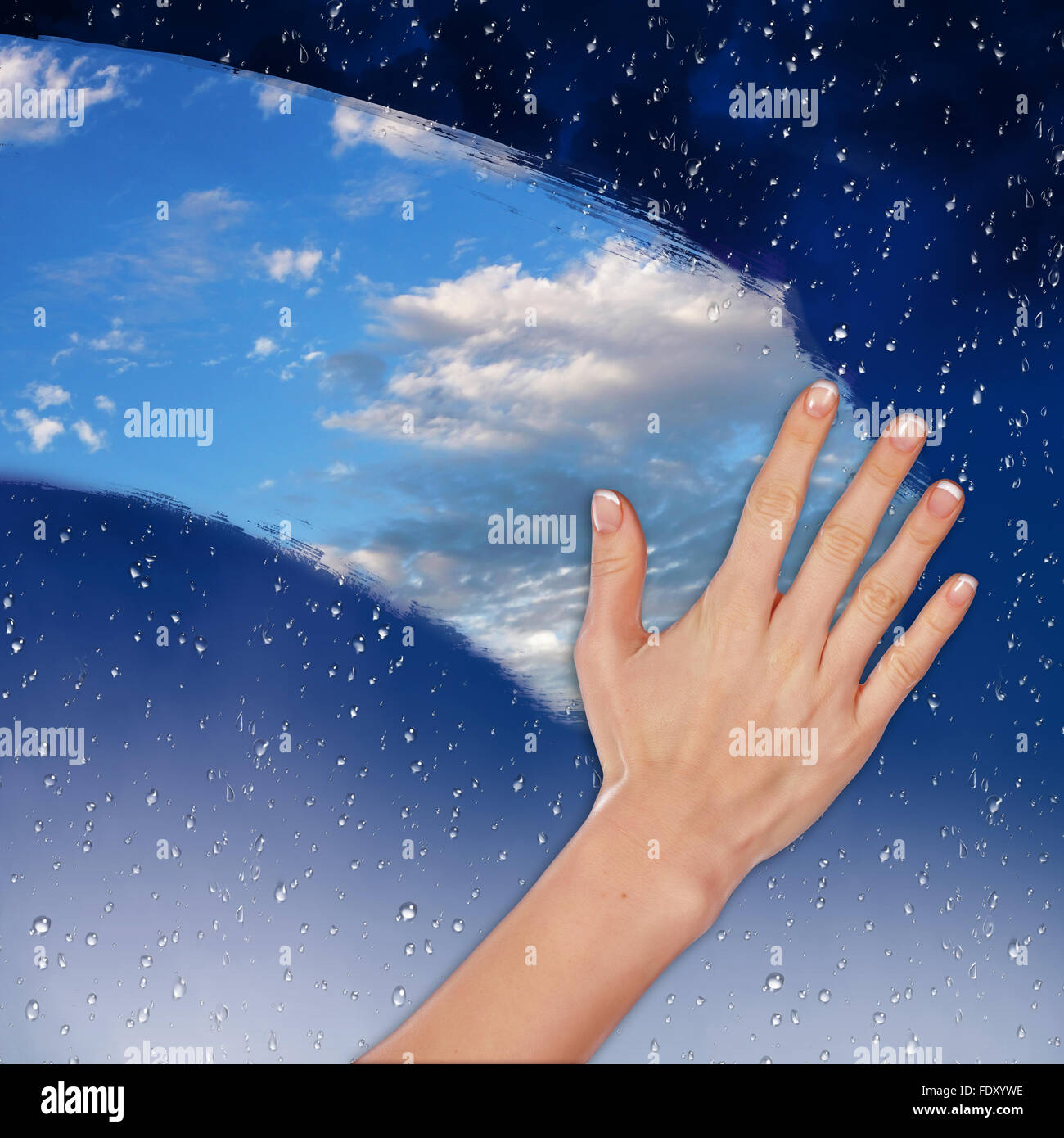 Hand cleaning window with blue sky and white clouds Stock Photo - Alamy