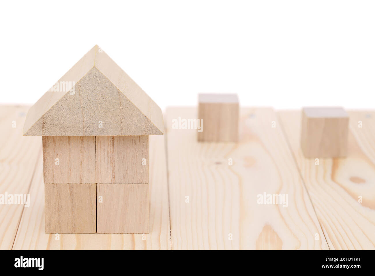 Wooden toy house with natural colored toy blocks Stock Photo Alamy