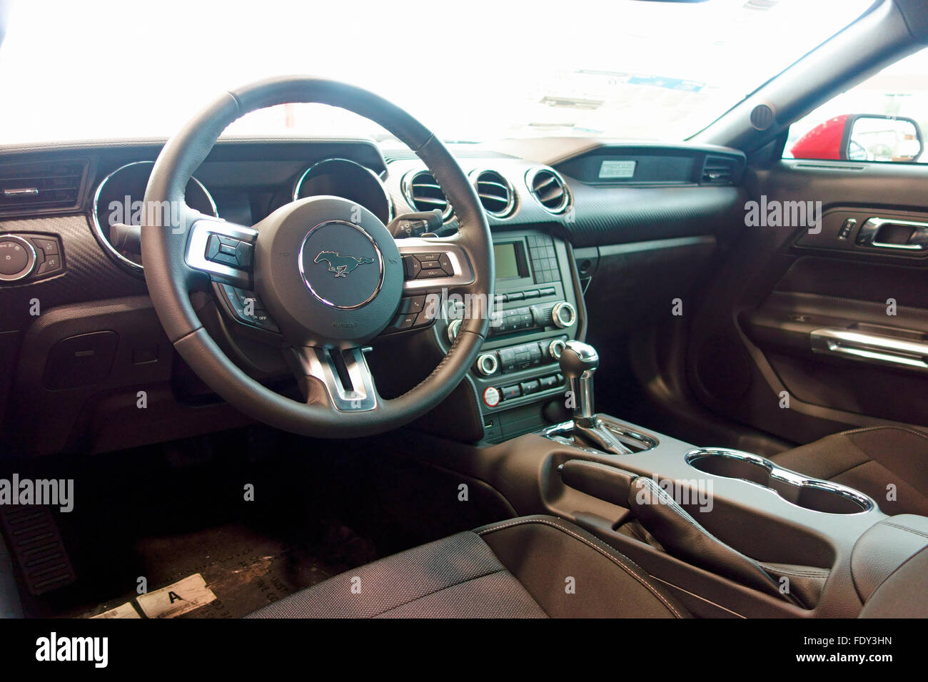 dash steering wheel and interior of a 2016 Ford Mustang car automobile Stock Photo