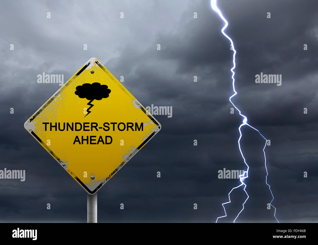 Yellow Warning Sign Of Bad Weather Ahead Against Stormy Sky Stock Photo