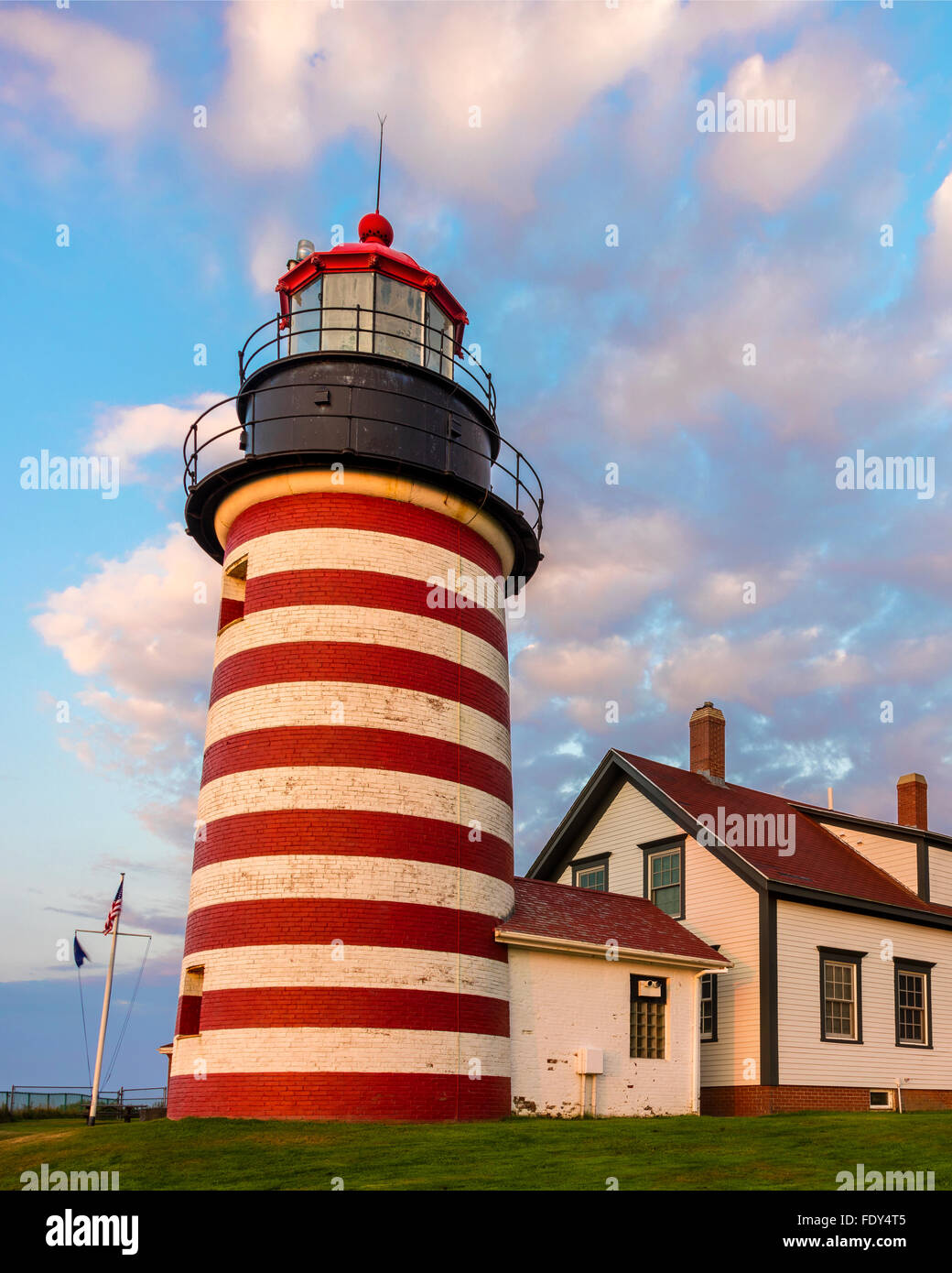 Lubec, Maine: West Quoddy Head Light with morning clouds Stock Photo