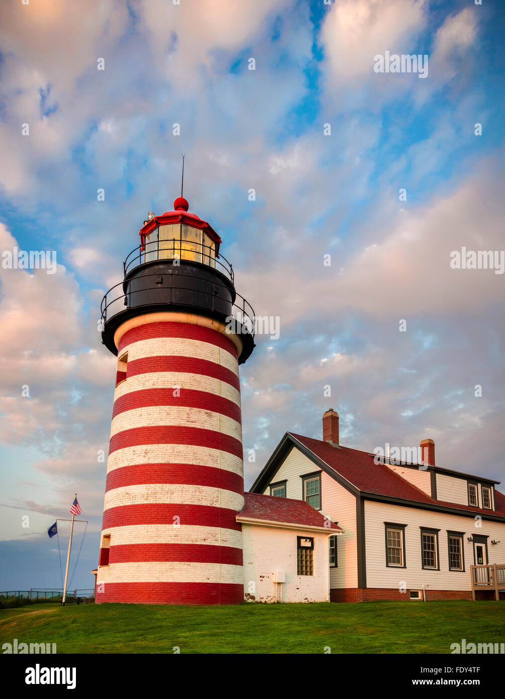 Lubec, Maine: West Quoddy Head Light with morning clouds Stock Photo