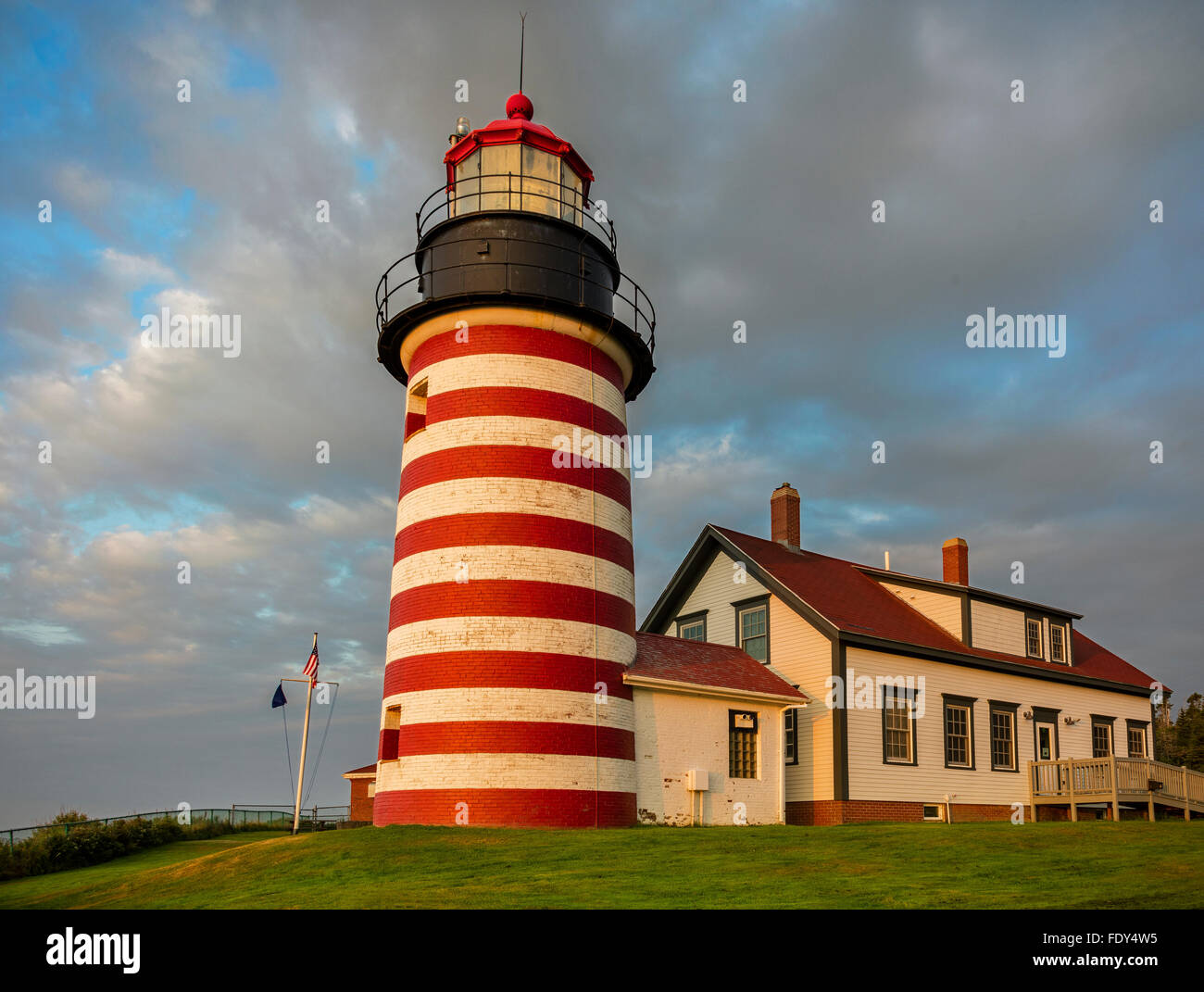 Lubec, Maine: West Quoddy Head Light with clearing storm clouds Stock Photo