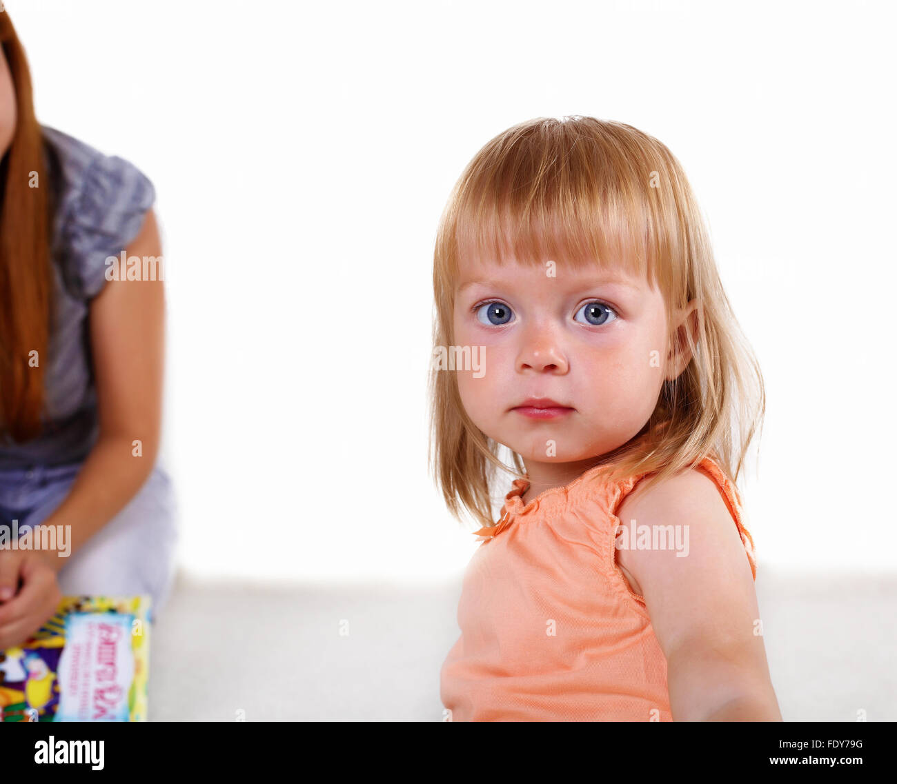 Portrait of a little blond girl in studio Stock Photo - Alamy