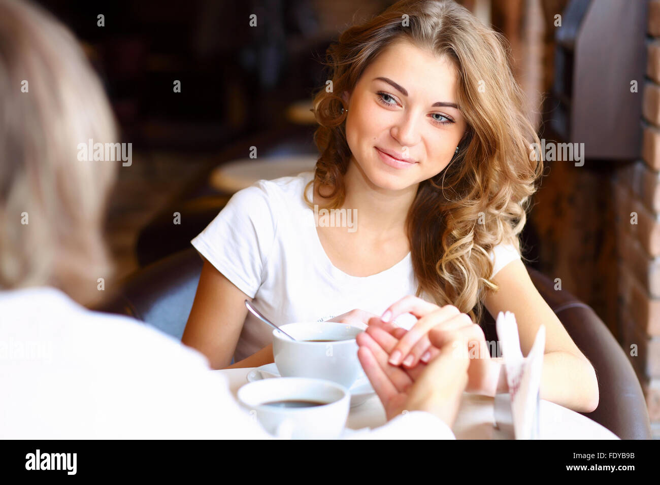 Portrait of young pretty woman sitting in restaurant Stock Photo - Alamy