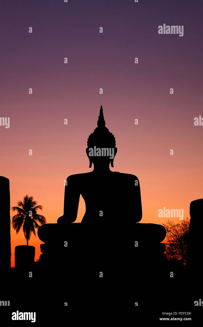 Buddha silhouette at sunset with large copyspace Stock Photo