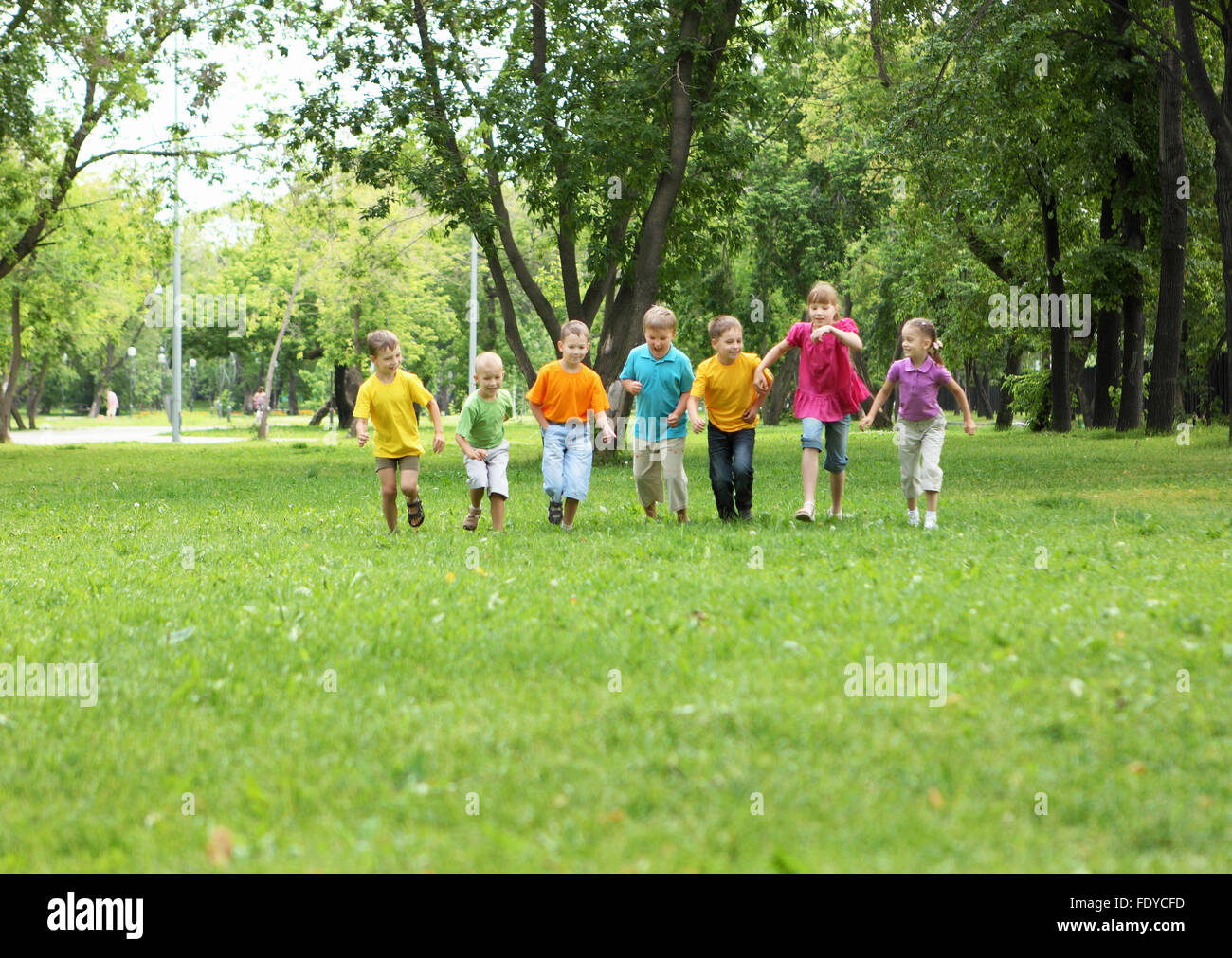 Group of children having fun together in the park Stock Photo - Alamy