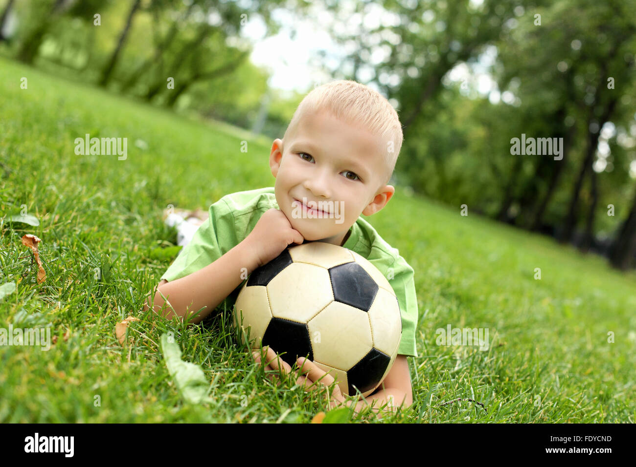 Little boy in the summer park with a ball Stock Photo - Alamy