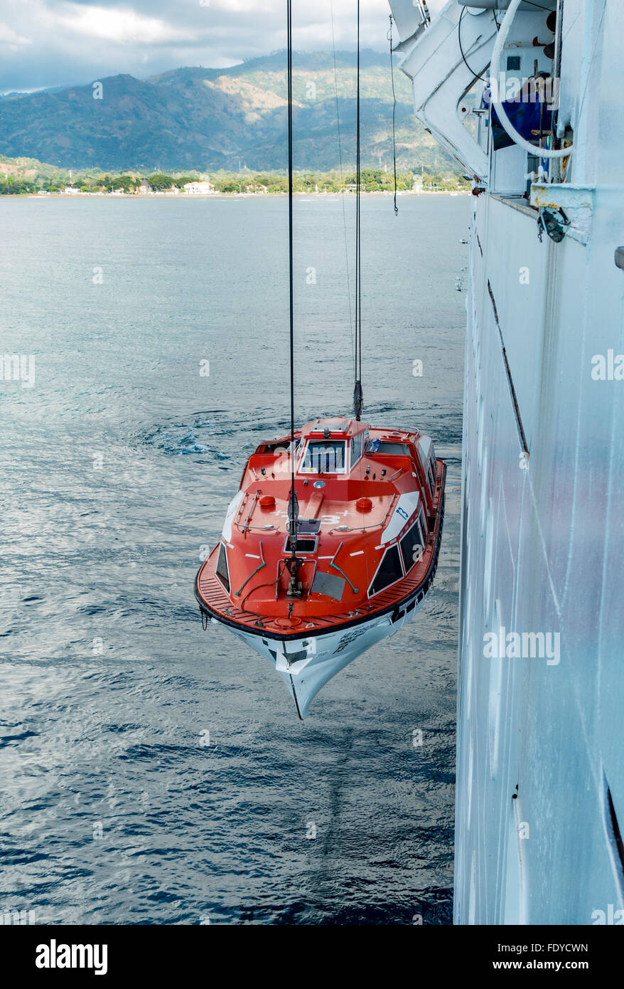 Cruise ship tender being hoisted aboard ship Stock Photo Alamy