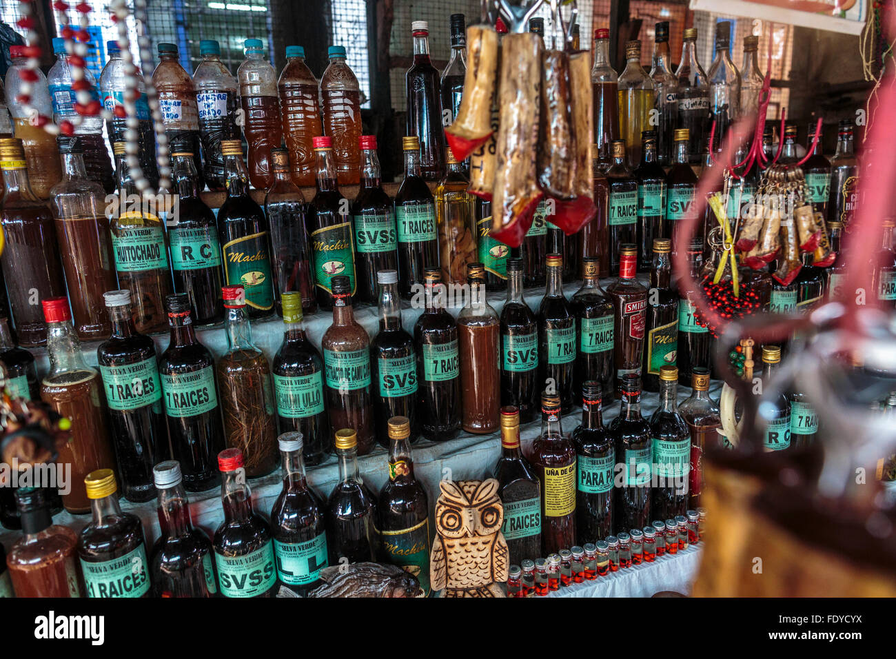 Bottles of plant extracts and medicine in Shaman's Alley also known as Sorceror's Alley in Belen Market Iquitos in Peru's Amazon Stock Photo