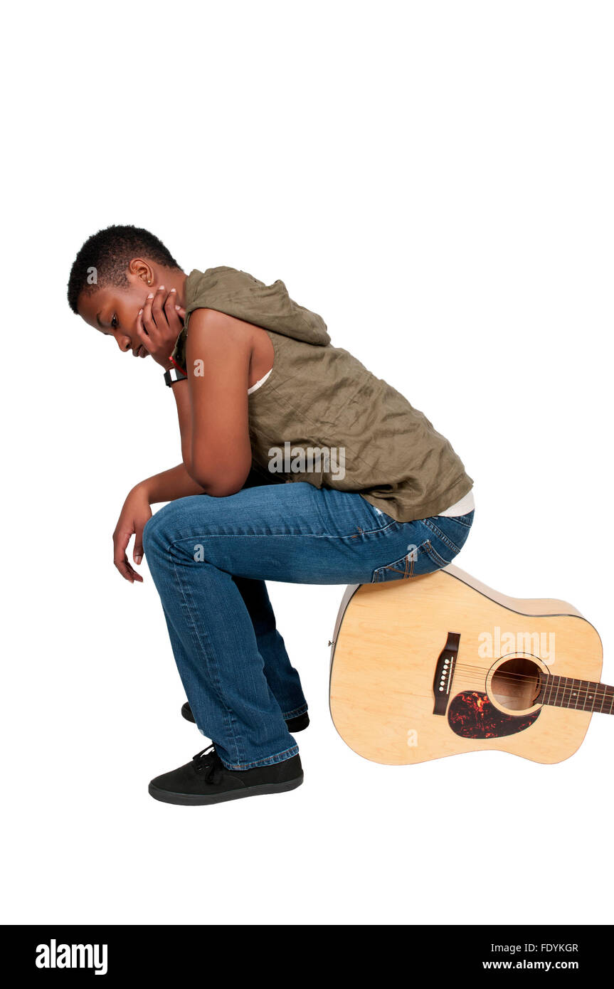 Beautiful young woman playing an acoustic guitar Stock Photo - Alamy