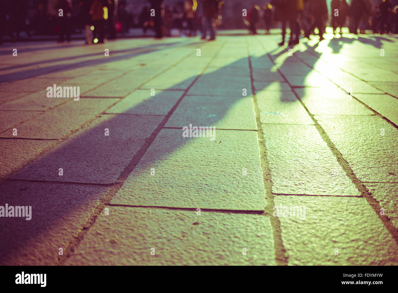 Vintage filtered pedestrian out of focus filtered walking on sidewalk ...
