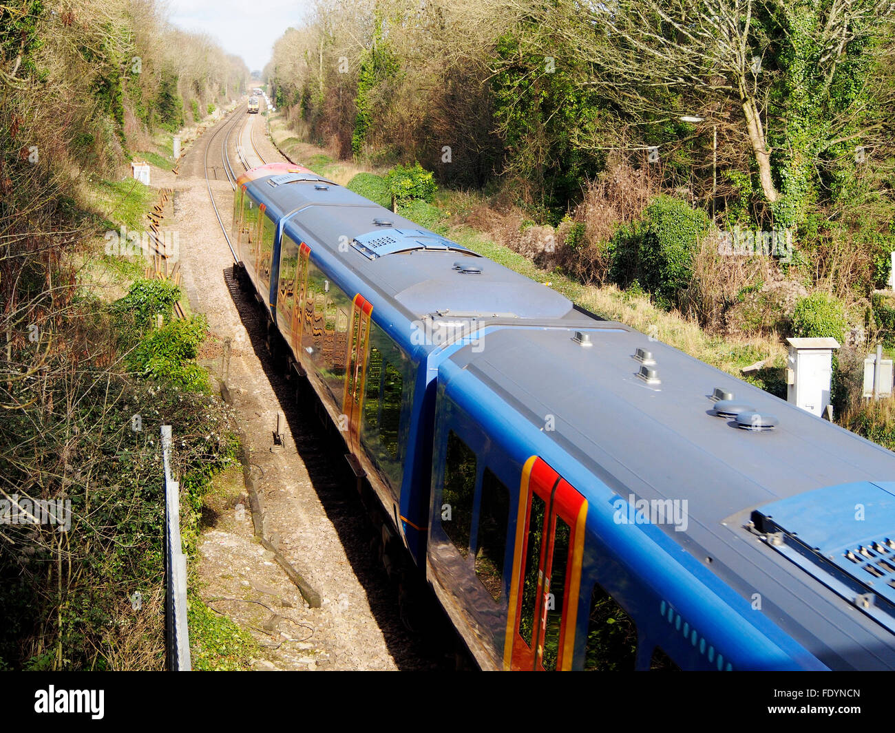 South West Trains (SWT) class 450 outer suburban electric train at St Cross south of Winchester heading towards London. Stock Photo