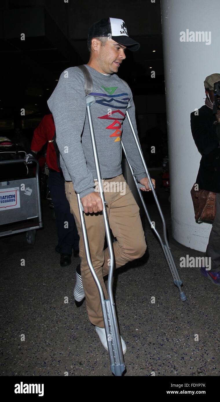 Jessica Alba and Cash Warren arrive at Los Angeles International (LAX) Airport with their two