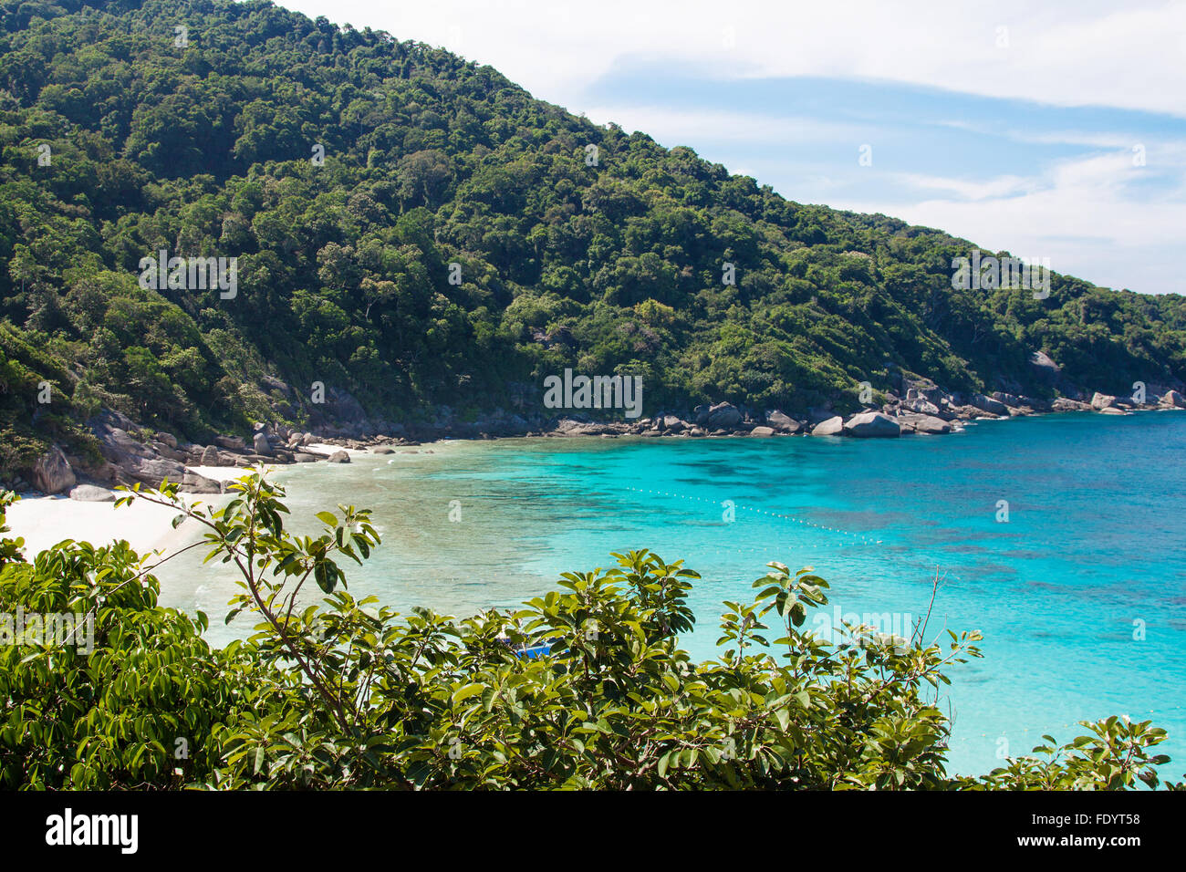 Asian Similan islands in Thailand with blue clean water and trees Stock Photo