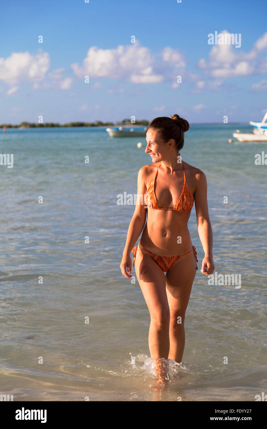 Woman on beach at Hauru Point, Mo'orea, Society Islands, French Polynesia (MR) Stock Photo
