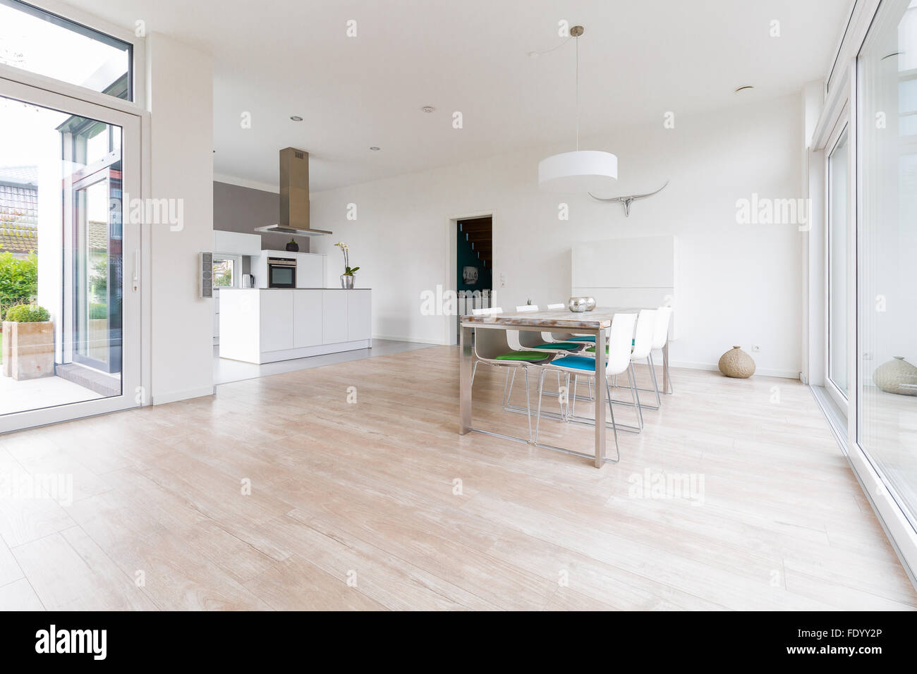 Interior of a modern bright dining-room with open kitchen Stock Photo ...