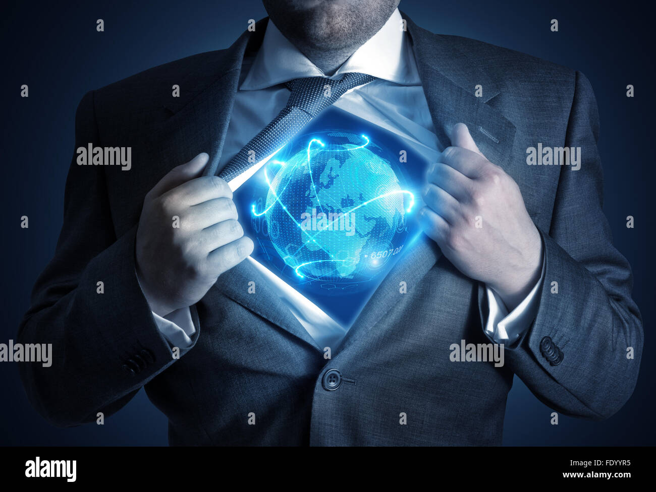 Global Businessman. A businessman revealing a connected world. Business concept Stock Photo