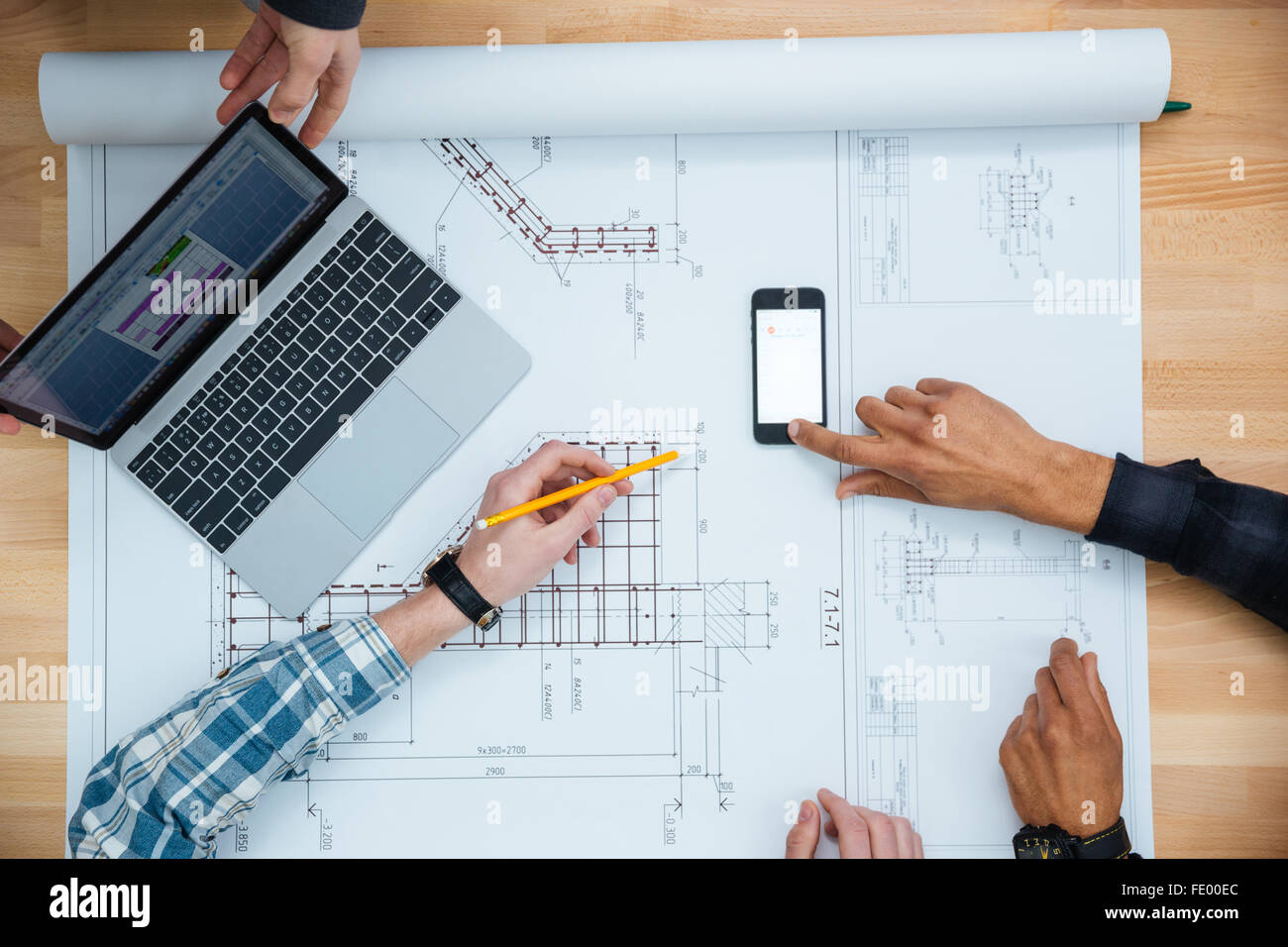 Top View Of Group Of People Working With Laptop Smartphone And Blueprint Stock Photo Alamy