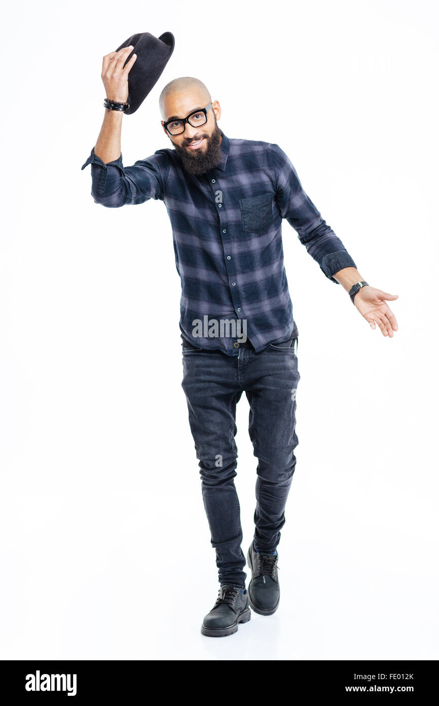 Happy bearded african american man in glasses greeting and taking off his hat Stock Photo
