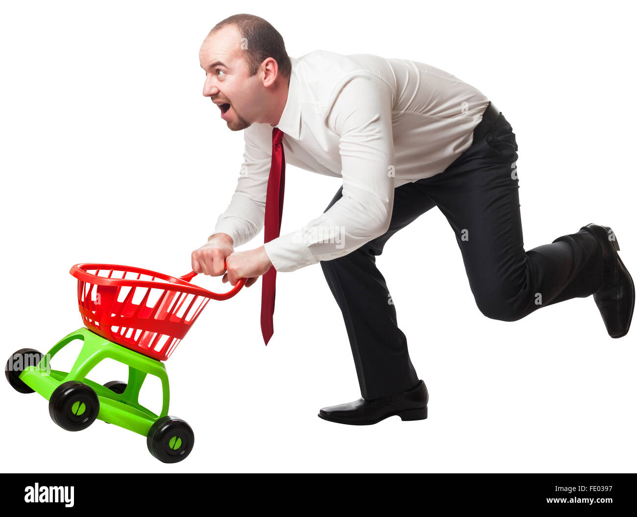 isolated man with toy shopping cart Stock Photo