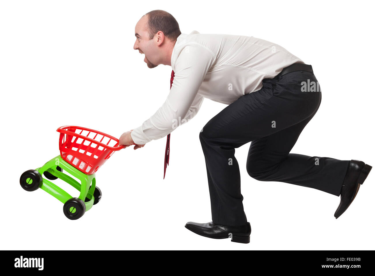 isolated man with toy shopping cart Stock Photo