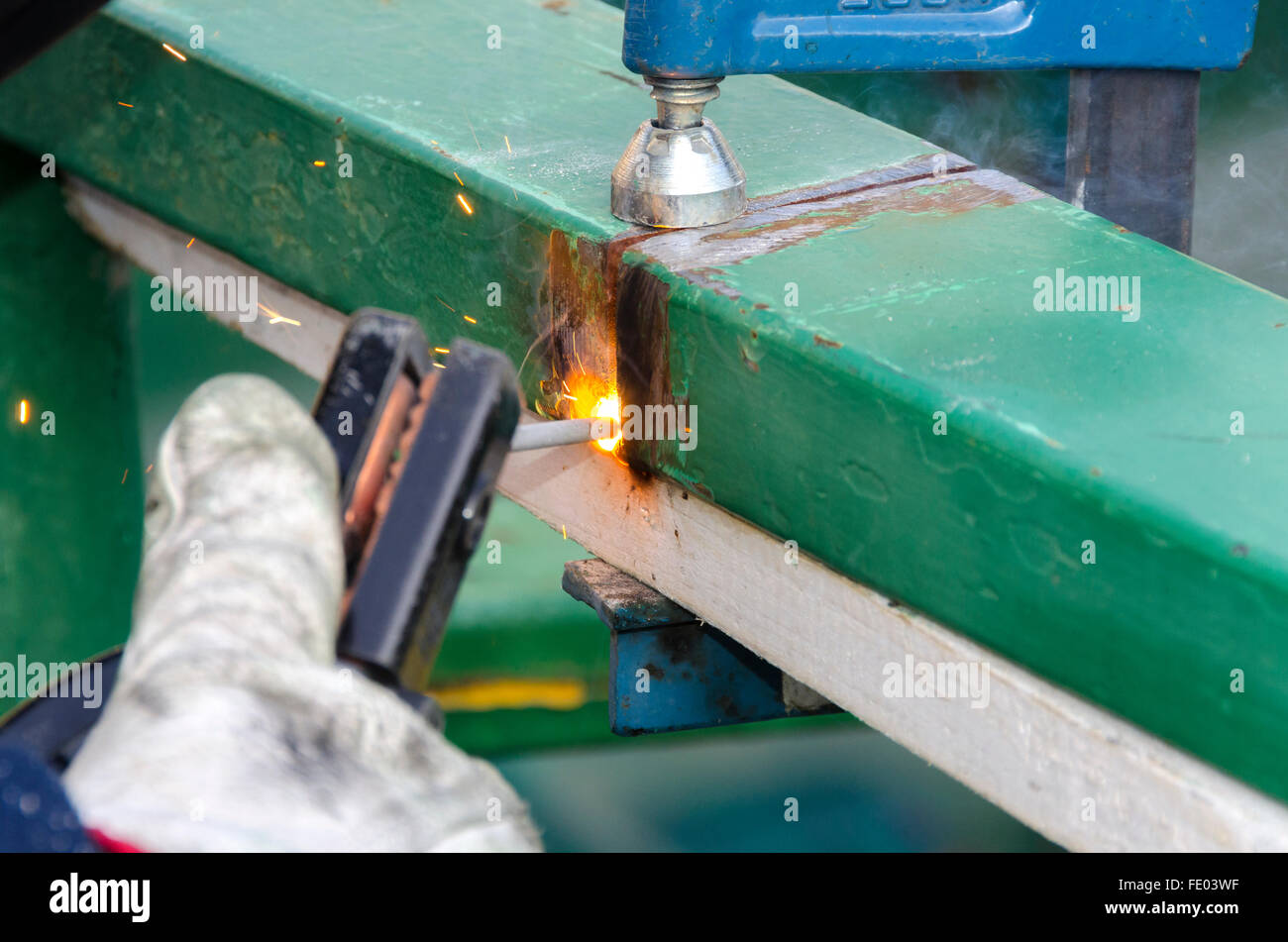 worker while welding a steel railing Stock Photo