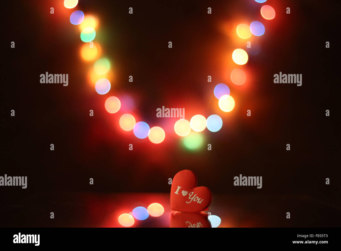 valentine holiday greeting card with red heart and blurry lights Stock Photo