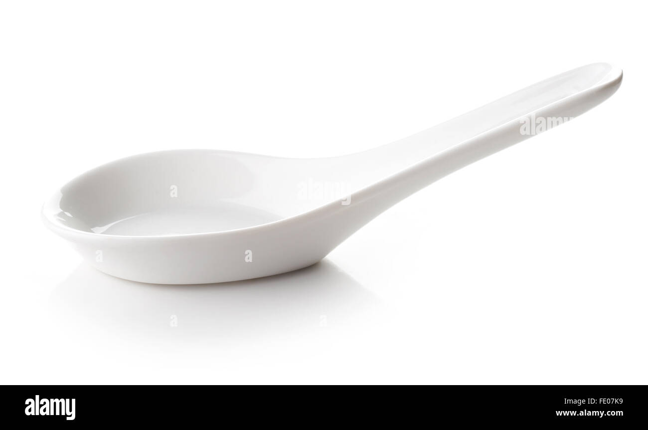 White empty porcelain spoon isolated on white background Stock Photo