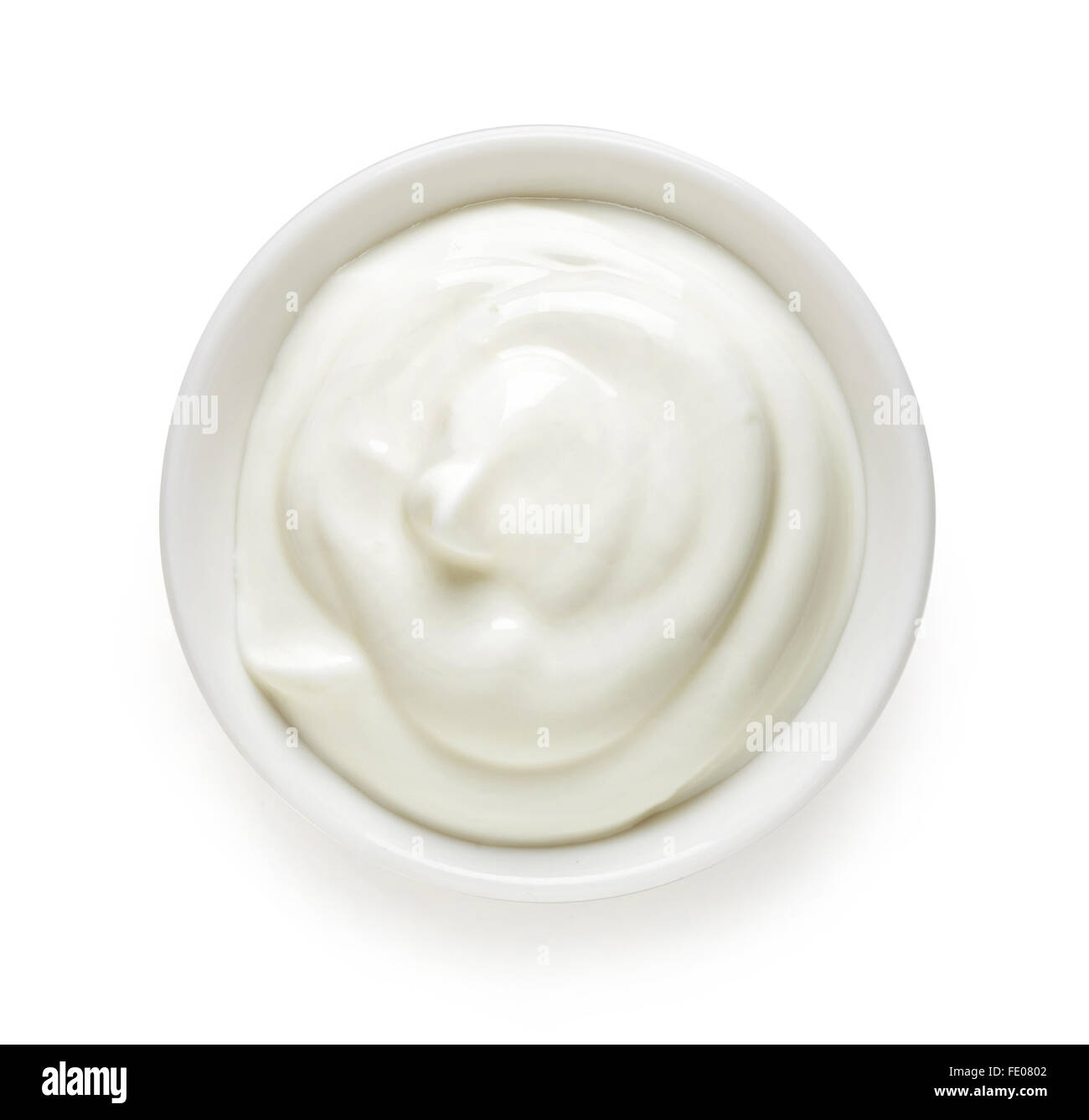 Bowl of cream on white background, top view Stock Photo