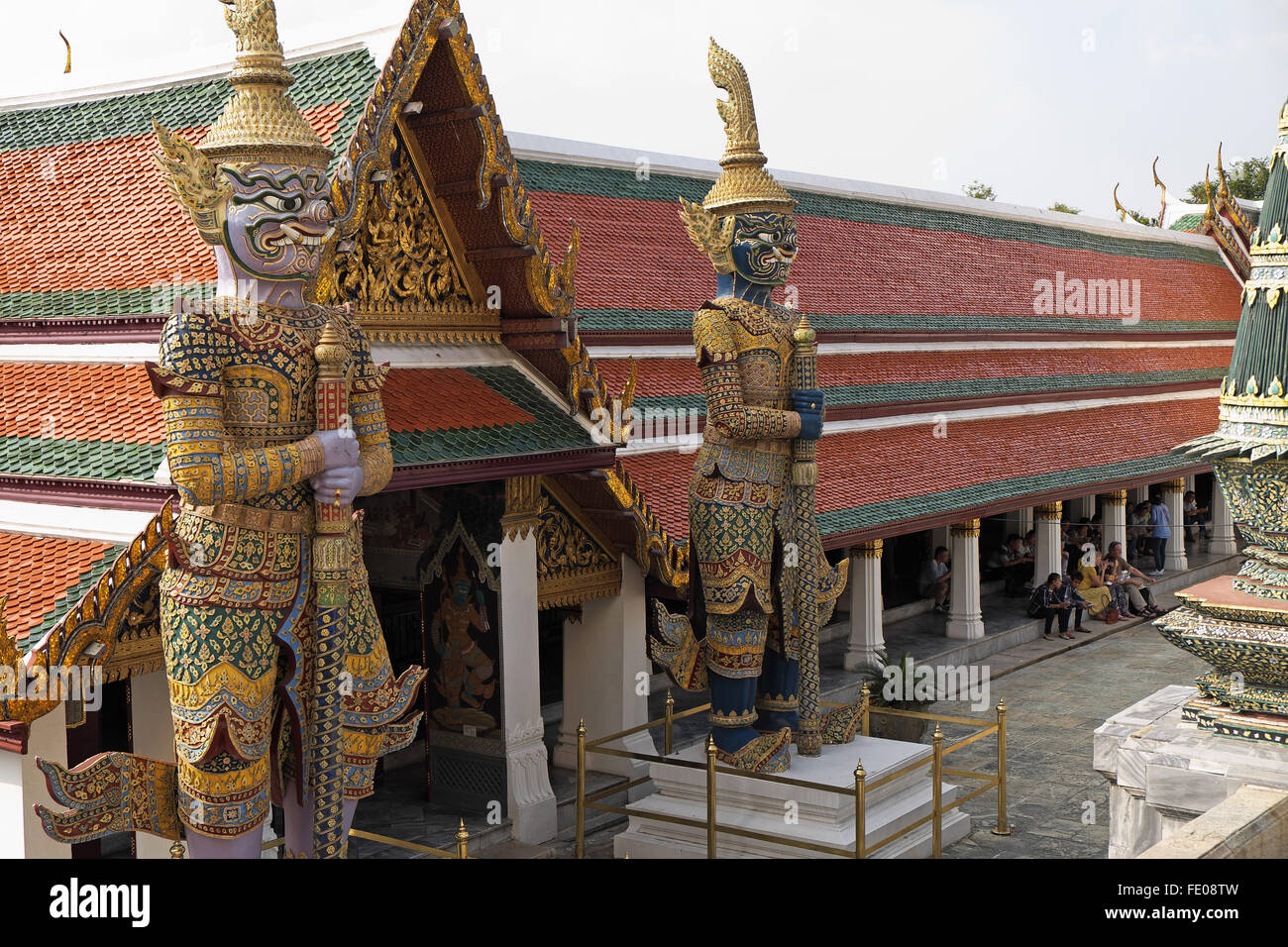 Giant temple guardian statues with Hor Phra Gandhararat beyond, The