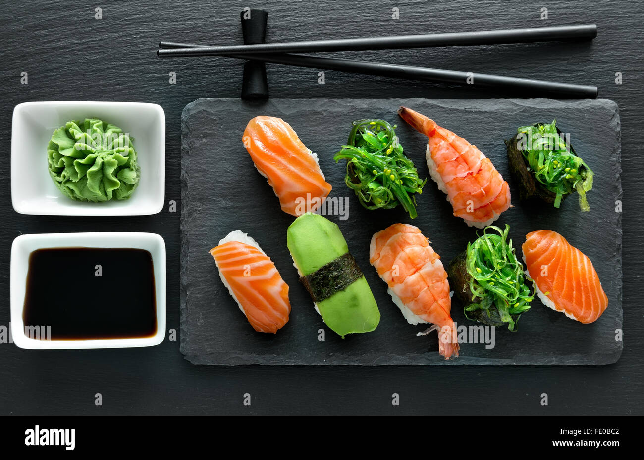 Slate plate with sushi set and wasabi Stock Photo