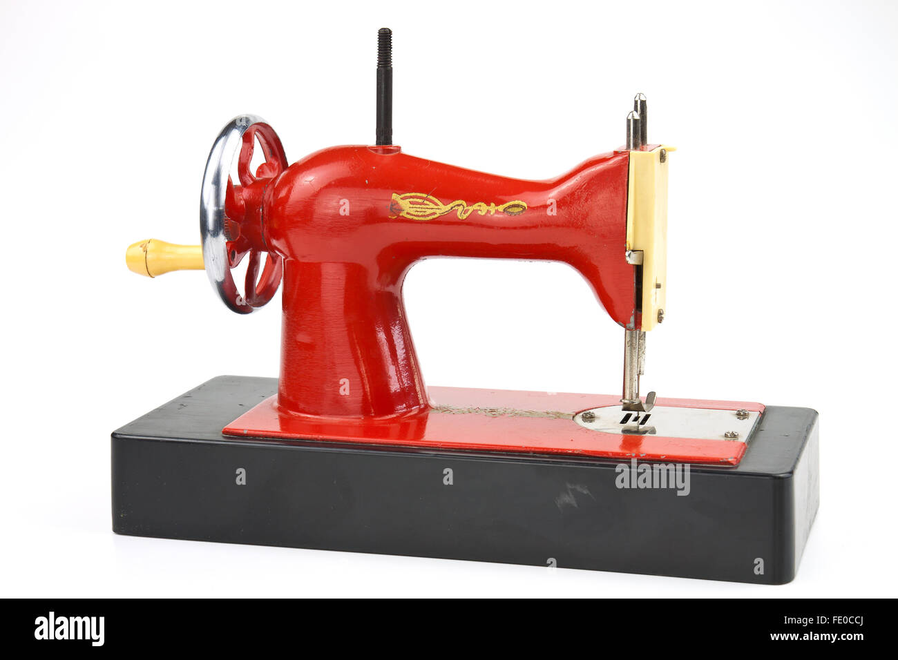 Realistically made sewing machine as a toy for practical training of children Stock Photo
