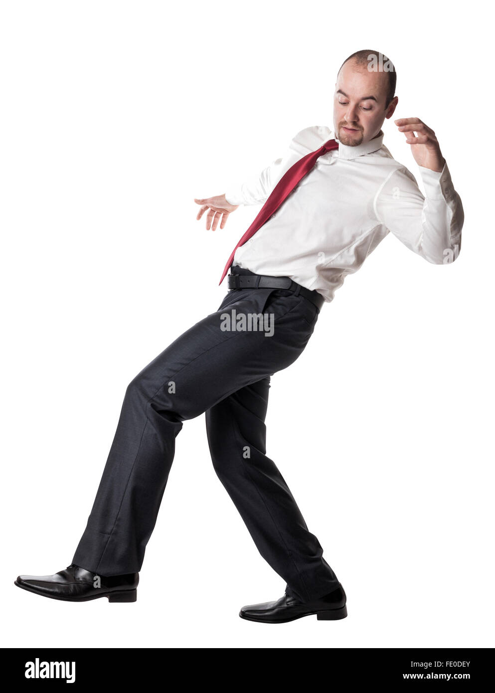 man try to balance himself isolated on white Stock Photo