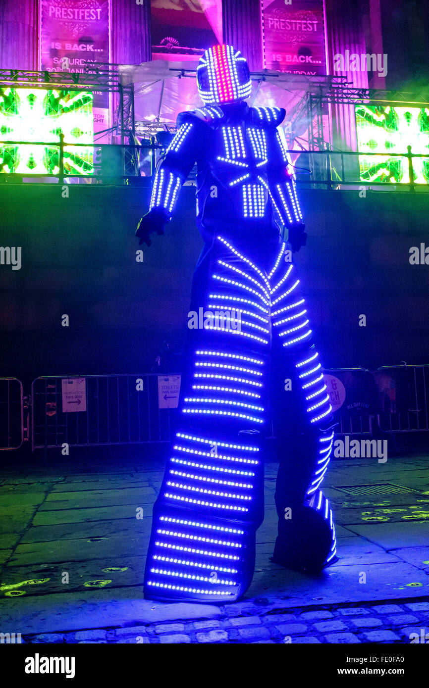 Man on stilts in LED lights costume entertains at PrestFest event in Preston, Lancashire. Stock Photo