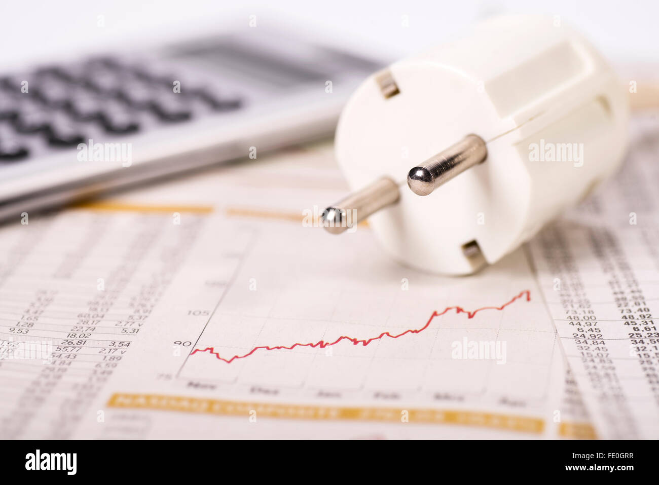 Plug and graphic with increasing curve symbolizing high electricity costs. Stock Photo