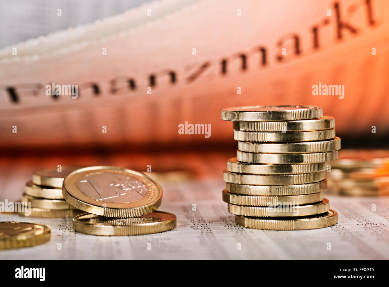 Daily newspaper with the words financial market and coins Stock Photo