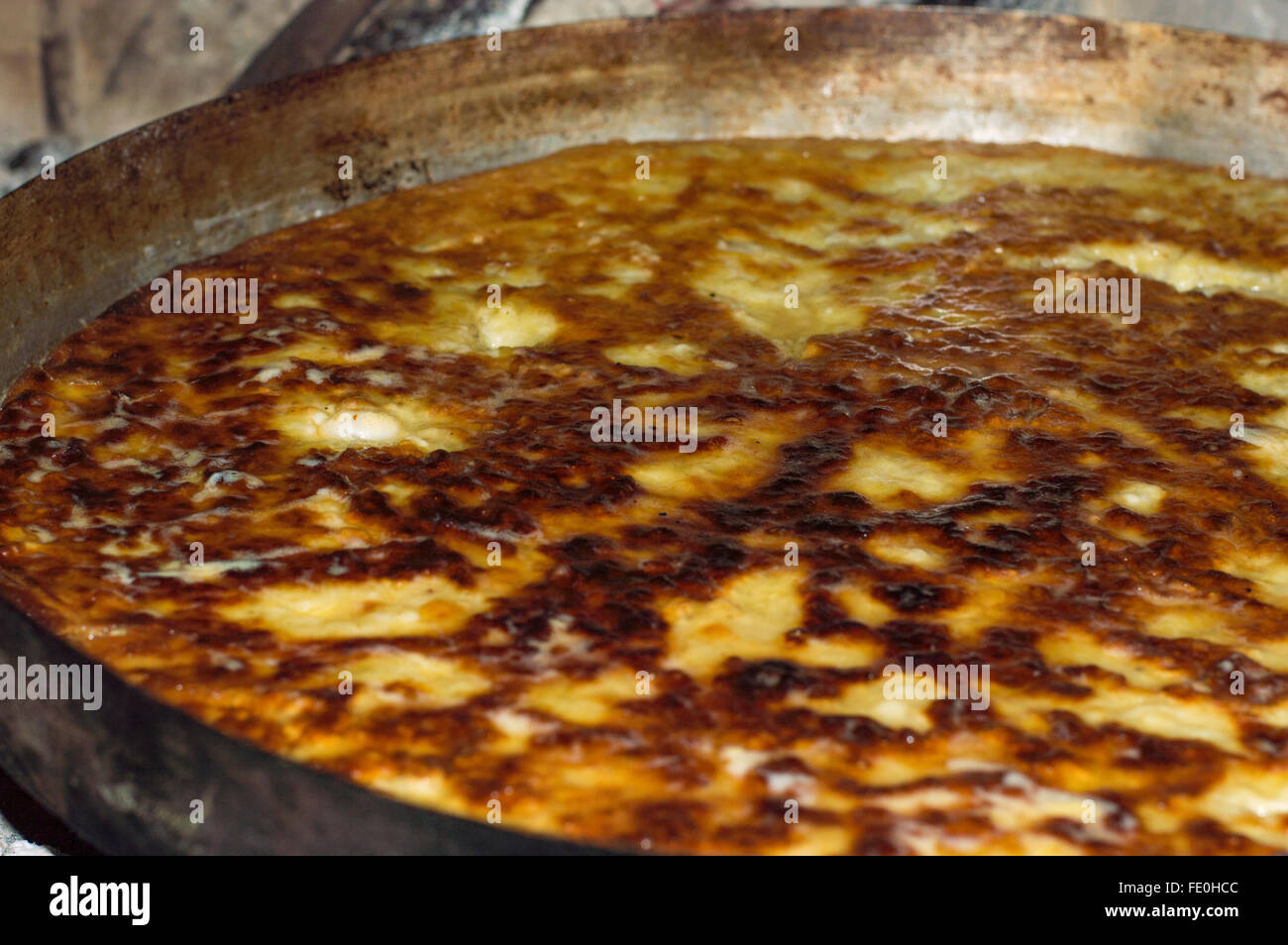 Greek Traditional potato pie on barbecued Stock Photo
